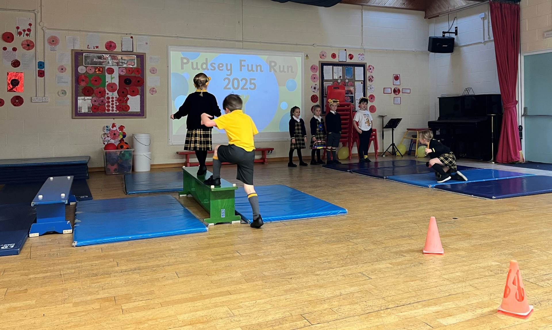 Children at the Longdon site complete an indoor Pudsey Run challenge for Children in Need