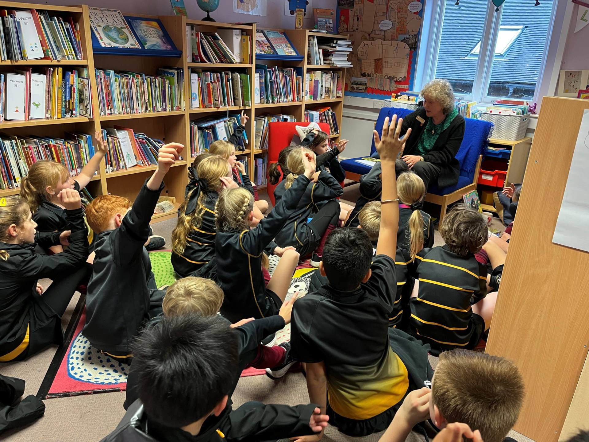 Librarian Mrs Mills at Longdon with children in the Library Club